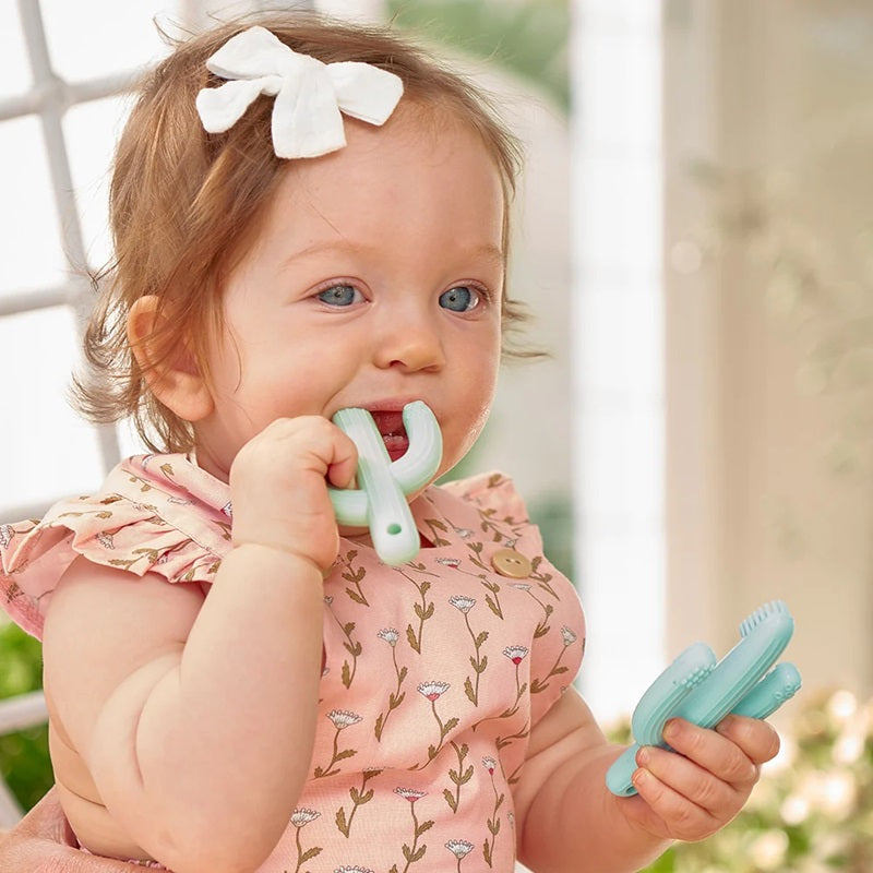 Girl chewing cactus teether | Chewable