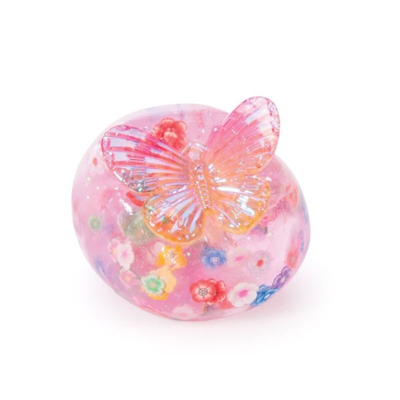 Pink glitter fairy putty with colourful embedded flowers and an iridescent butterfly topper.