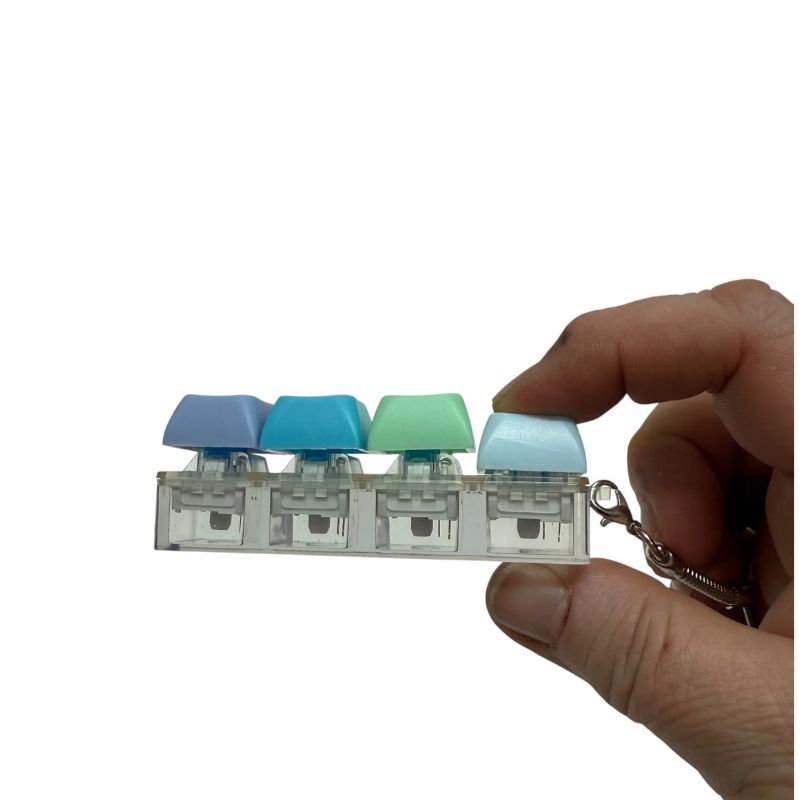 Hand holding keyboard click fidget toy with pastel mechanical keys