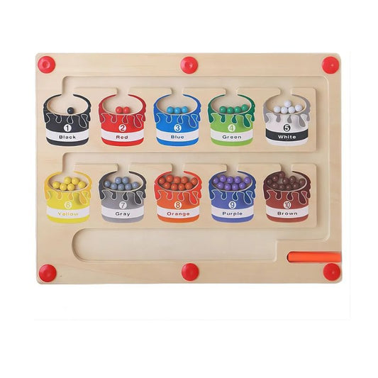 magnetic colour-sorting maze toy with a pen guiding beads into numbered paint-pot sections for learning colours and fine-motor skills.