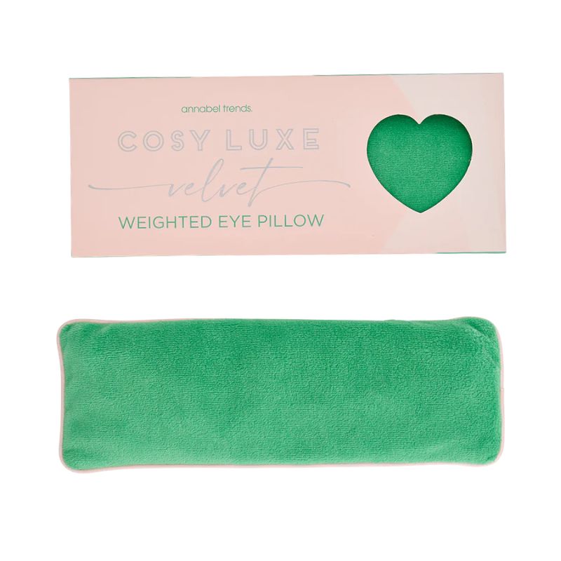 Meadow green velvet weighted eye pillow designed for sensory relaxation and calming deep-pressure comfort displayed with pastel packaging.