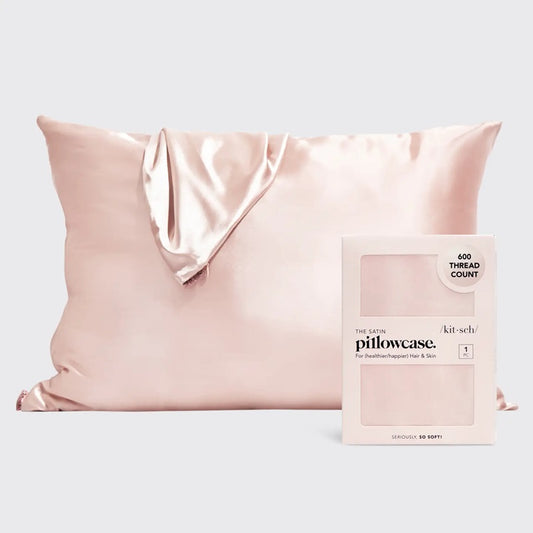 Blush pink satin pillowcase with ultra-smooth sensory fabric designed to reduce frizz and support restful sleep